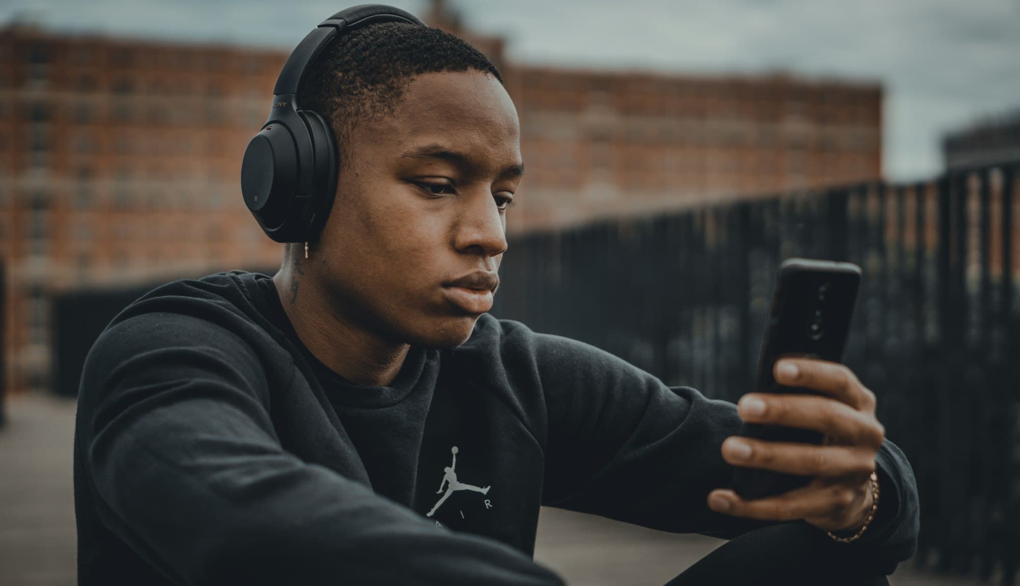 A man listening on wireless over-ear headphones